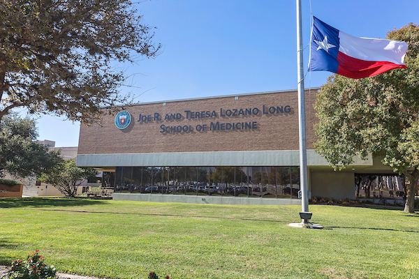 Long School of Medicine campus building with flag