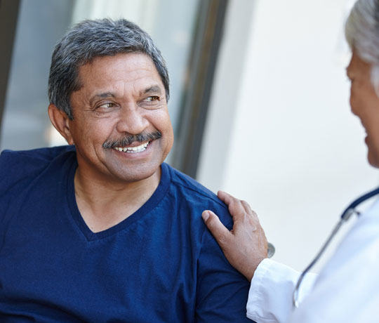 Smiling man with physician