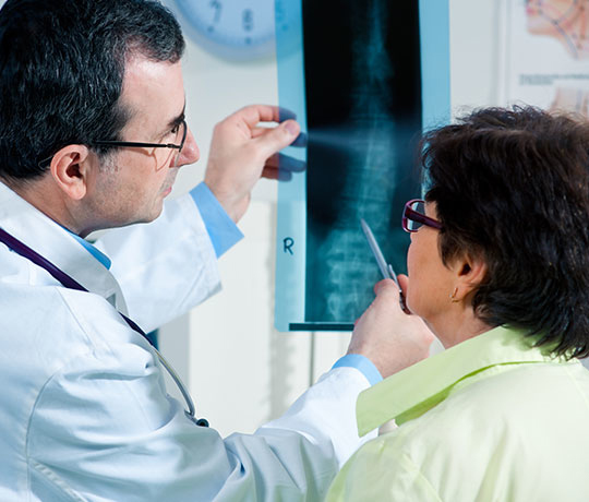 Scoliosis specialist with patient