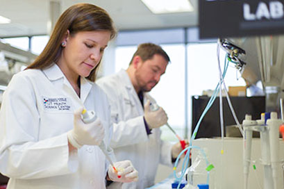 Graduate School of Biomedical Sciences UT Health Science Center San Antonio researchers in lab