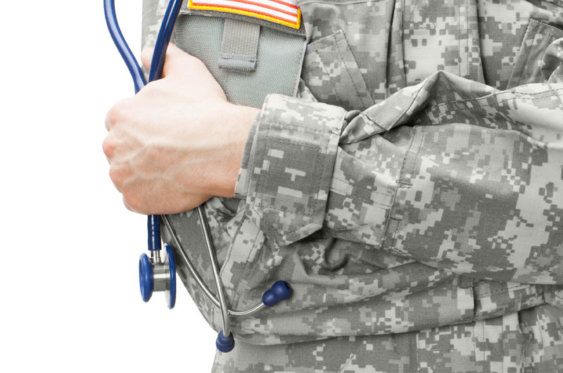 military doctor holding stethoscope