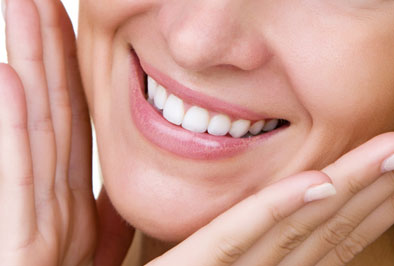 Closeup of a dental implant restoration patient smiling