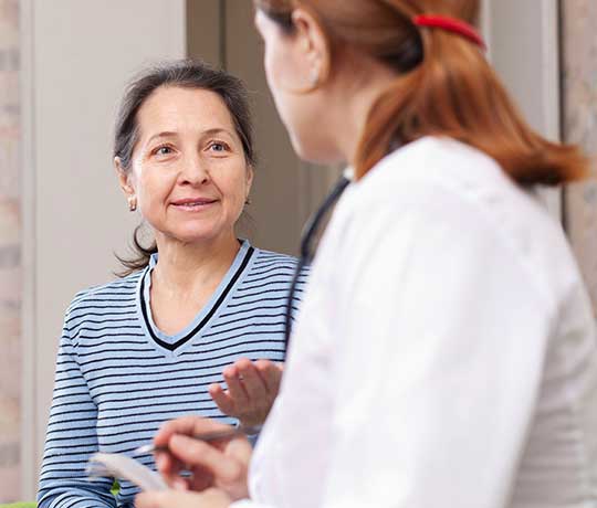 Patient visting with a physician
